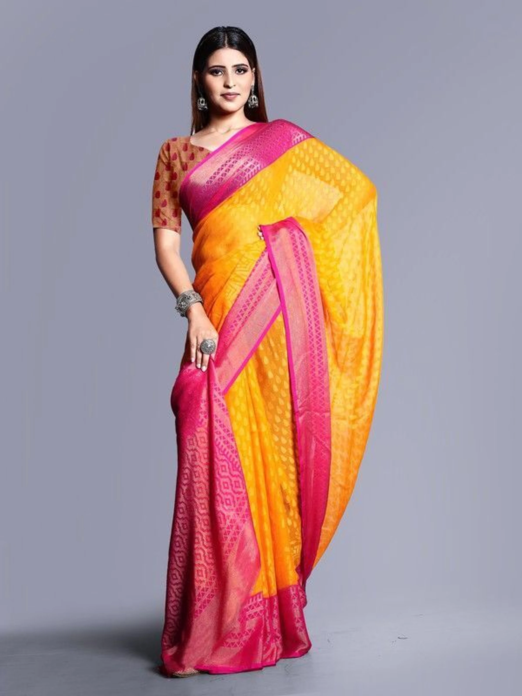 hetvi Printed Bollywood Brasso Saree (Pink, Yellow)